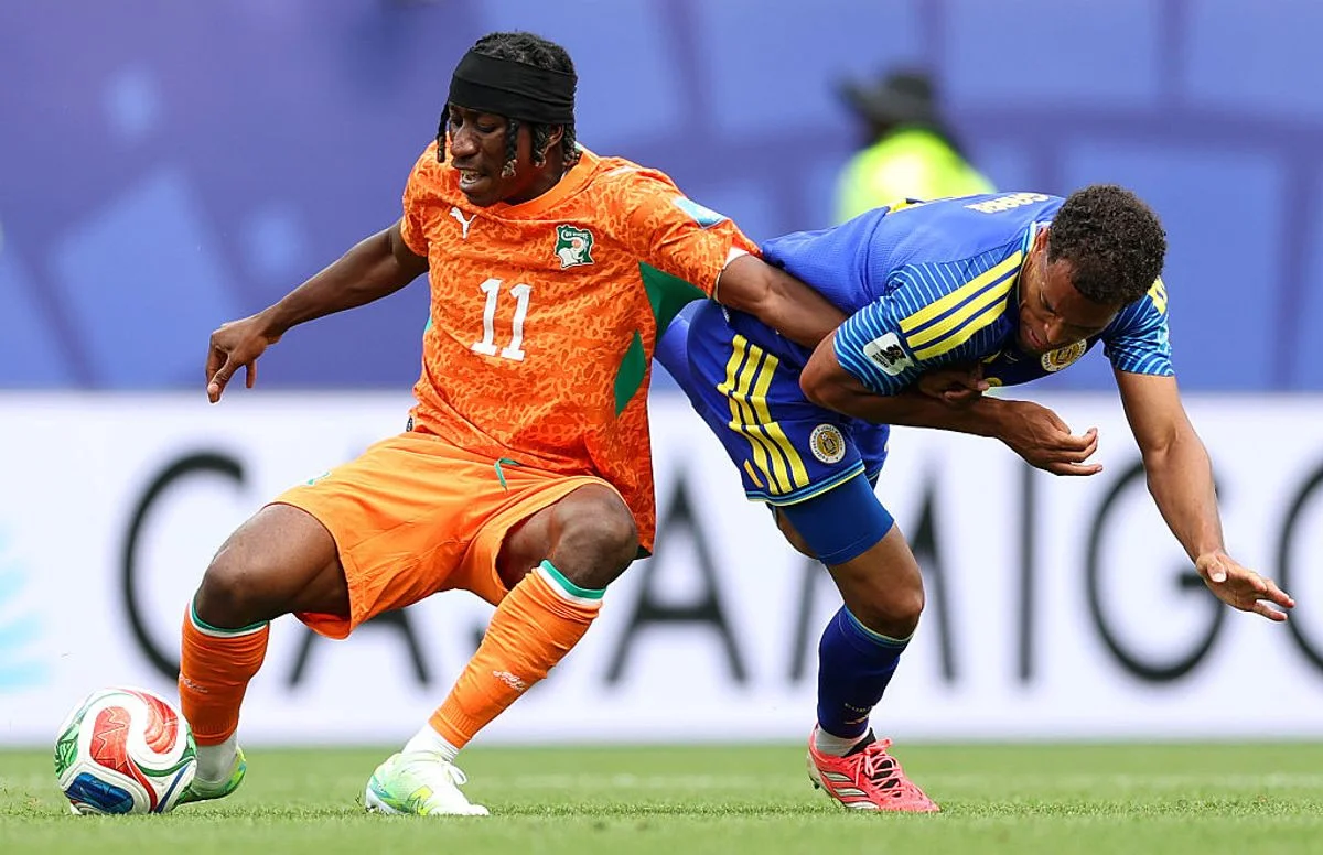 PHILADELPHIA, PENNSYLVANIA - JUNE 25: Yan Diomande #11 of Cote d'Ivoire controls the ball against Jurien Gaari #3 of Curacao during the FIFA World Cup 2026 Group E match between Curacao and Cote D'Ivoire at Philadelphia Stadium on June 25, 2026 in Philadelphia, Pennsylvania. (Photo by Steph Chambers - FIFA/FIFA via Getty Images)
