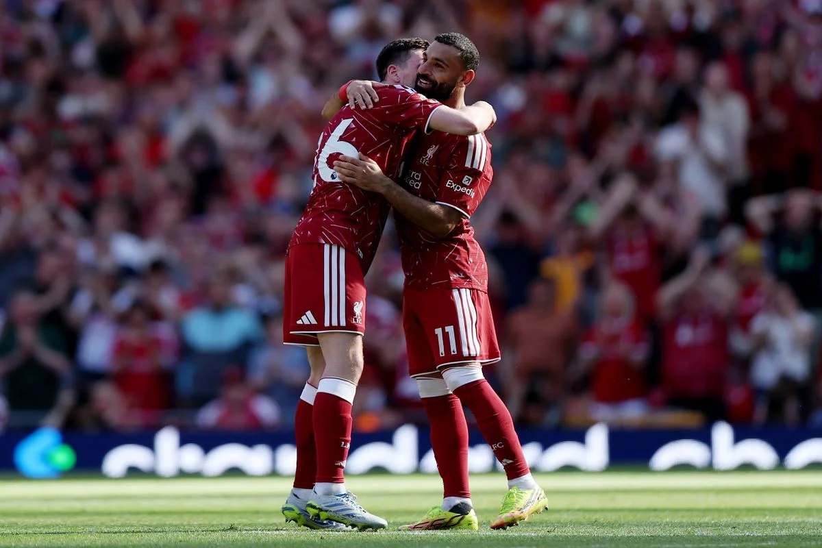 Mohamed Salah and Andy Robertson embrace after their final Liverpool appearance.