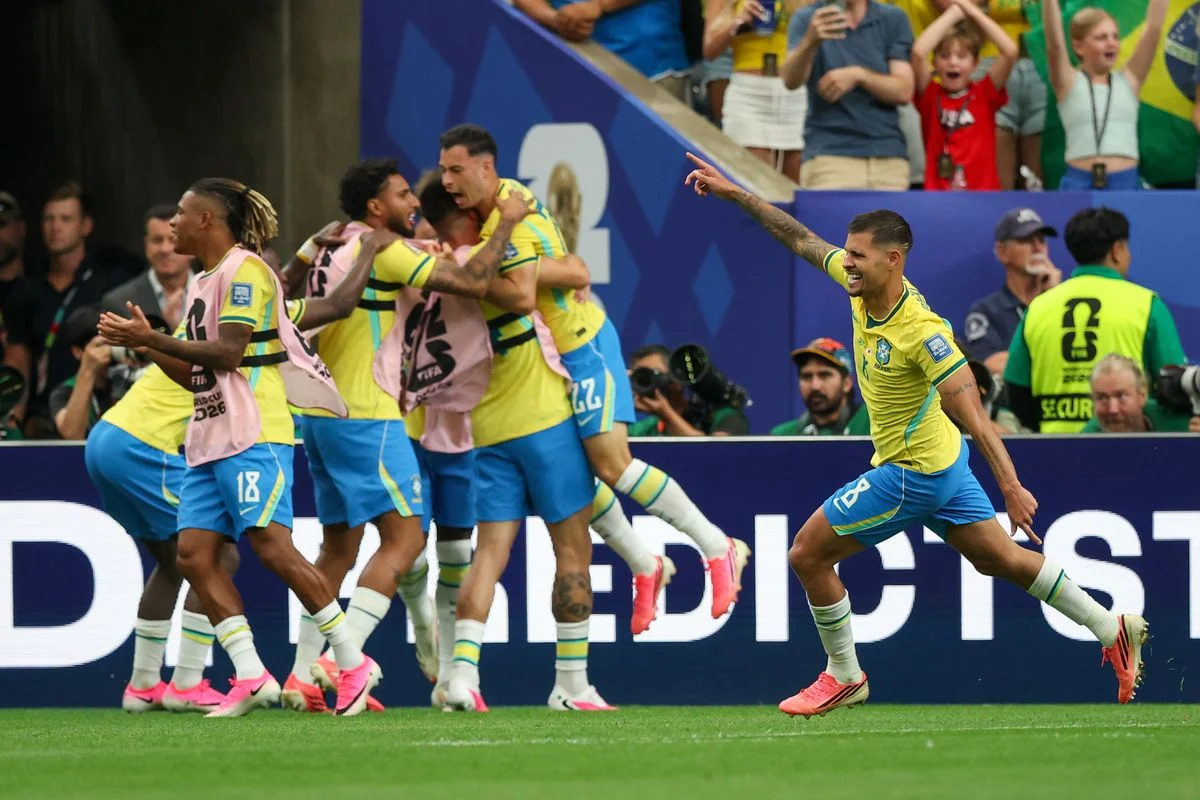 Brazil's players celebrate after Gabriel Martinelli's stoppage-time goal against Japan